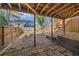 View from under back porch overlooking fenced yard and home's surrounding greenery at 5043 Bell Dr, Smyrna, GA 30080
