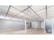 Finished basement with tile flooring and columns, and a paneled ceiling at 5043 Bell Dr, Smyrna, GA 30080