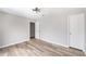 A spacious bedroom with wood floors, neutral paint, and closet doors at 5043 Bell Dr, Smyrna, GA 30080