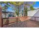 A wooden deck overlooking the backyard with greenery at 5043 Bell Dr, Smyrna, GA 30080