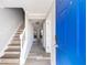 Inviting entryway featuring newly refinished wood floors, fresh paint, and a bright blue front door at 5043 Bell Dr, Smyrna, GA 30080
