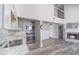 View from the kitchen overlooking the living room with a fireplace and high ceilings at 5043 Bell Dr, Smyrna, GA 30080