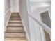 A staircase featuring painted risers and newel posts at 5043 Bell Dr, Smyrna, GA 30080