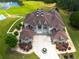Expansive property featuring a luxurious home with a circular driveway and lush landscaping at 535 Waters Way, Fayetteville, GA 30215