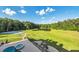 Expansive backyard with basketball court, pond, pool, and waterfall feature at 535 Waters Way, Fayetteville, GA 30215