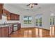 Wet bar area with wood cabinets, granite countertop, and a mini-fridge, next to french doors at 535 Waters Way, Fayetteville, GA 30215
