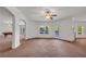 Finished basement with neutral carpet, walkout access, and open archways at 535 Waters Way, Fayetteville, GA 30215