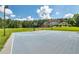 Outdoor blue basketball court with a hoop and lighting situated near a home at 535 Waters Way, Fayetteville, GA 30215