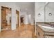 Bathroom area featuring glass shower, vanity, and walk-in closet at 535 Waters Way, Fayetteville, GA 30215