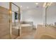 Bathroom featuring tile flooring, a glass shower enclosure, and a soaking tub with a matching tile surround at 535 Waters Way, Fayetteville, GA 30215