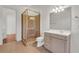 Elegant bathroom featuring a glass shower enclosure and a modern vanity with a large mirror at 535 Waters Way, Fayetteville, GA 30215