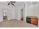 Large bedroom includes a wet bar, neutral carpet, an adjacent bathroom, and ample closet space at 535 Waters Way, Fayetteville, GA 30215