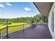 Spacious covered deck overlooking a pond and wooded area at 535 Waters Way, Fayetteville, GA 30215