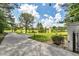 Long private driveway leading to an estate with a pond at 535 Waters Way, Fayetteville, GA 30215