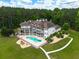 Luxurious home featuring an in-ground pool, hot tub, and large deck for outdoor entertaining at 535 Waters Way, Fayetteville, GA 30215