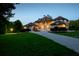 A sprawling estate with meticulous lawn and landscape, featuring multiple gables and arched windows at 535 Waters Way, Fayetteville, GA 30215