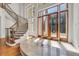 Grand foyer featuring a spiral staircase, double doors, and marble flooring with decorative inlays at 535 Waters Way, Fayetteville, GA 30215