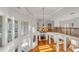 Open foyer featuring high ceilings, a striking chandelier, and a curved staircase with wrought iron railings at 535 Waters Way, Fayetteville, GA 30215