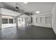 Spacious three-car garage featuring high ceilings, storage and painted flooring at 535 Waters Way, Fayetteville, GA 30215