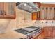 Gourmet kitchen featuring stainless steel appliances, pot filler, tile backsplash, and granite countertops at 535 Waters Way, Fayetteville, GA 30215
