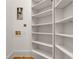 Bright laundry room with white built-in shelving providing storage at 535 Waters Way, Fayetteville, GA 30215