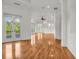 Spacious living room with hardwood floors, white walls, recessed lighting, and a balcony at 535 Waters Way, Fayetteville, GA 30215