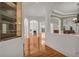 Spacious living room showcasing hardwood floors, arched doorways, and large windows for ample natural light at 535 Waters Way, Fayetteville, GA 30215