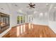Living room with a modern fireplace, hardwood floors, white walls, and access to a balcony at 535 Waters Way, Fayetteville, GA 30215