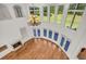 Living room with a chandelier, fireplace, and large windows offering views of the outdoors at 535 Waters Way, Fayetteville, GA 30215