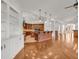 Spacious open-concept living room with hardwood floors and custom wood kitchen with large breakfast bar at 535 Waters Way, Fayetteville, GA 30215