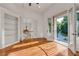 Study or office with beautiful hardwood floors, built-in bookshelves, and french doors at 535 Waters Way, Fayetteville, GA 30215