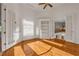 Study or office with beautiful hardwood floors, built-in bookshelves, and french doors at 535 Waters Way, Fayetteville, GA 30215
