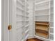 Well-organized pantry featuring ample shelving space and stylish wicker baskets for storage at 535 Waters Way, Fayetteville, GA 30215