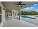 Expansive patio with columns overlooking an in-ground pool with ample seating area at 535 Waters Way, Fayetteville, GA 30215