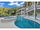 Wonderful in-ground pool with an attached spa and a well-manicured backyard area at 535 Waters Way, Fayetteville, GA 30215