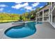 Beautiful in-ground pool and spa with a stone waterfall feature in a landscaped backyard at 535 Waters Way, Fayetteville, GA 30215
