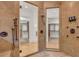 Stunning shower with dual showerheads, body jets, and glass doors to dressing area at 535 Waters Way, Fayetteville, GA 30215