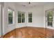 Bright sitting room with hardwood floors and views of the property at 535 Waters Way, Fayetteville, GA 30215
