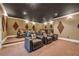 Home theater with tiered seating, projector, and professional sound system at 535 Waters Way, Fayetteville, GA 30215