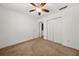 Bedroom with ceiling fan, closet, and door leading to the bathroom at 747 Crestwell Sw Cir, Atlanta, GA 30331