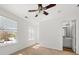 Bright bedroom with carpet flooring, ceiling fan, and windows for natural light at 747 Crestwell Sw Cir, Atlanta, GA 30331