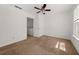 Bedroom featuring carpet flooring, ceiling fan, and windows for natural light at 747 Crestwell Sw Cir, Atlanta, GA 30331