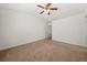 Neutral bedroom with a ceiling fan and a door leading to another room at 747 Crestwell Sw Cir, Atlanta, GA 30331