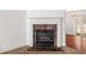 Close up on fireplace with marble surround and white mantle, adding a touch of elegance to the living space at 747 Crestwell Sw Cir, Atlanta, GA 30331