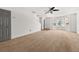 Bright living room with large windows, carpeted floor and a hallway, creating a warm and inviting atmosphere at 747 Crestwell Sw Cir, Atlanta, GA 30331