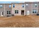 Backyard with a well-maintained lawn and brick house at 1310 Speckle Park Way, Stockbridge, GA 30281