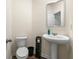 Modern half bathroom with a pedestal sink, and modern fixtures at 1310 Speckle Park Way, Stockbridge, GA 30281