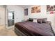 Bedroom featuring a bed, wardrobe mirror, and stylish wall decor at 1310 Speckle Park Way, Stockbridge, GA 30281