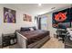 Bedroom with sports themed decor and a large window at 1310 Speckle Park Way, Stockbridge, GA 30281