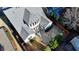 A well-kept roof and back patio on a sunny day are captured in this aerial view at 3355 Olivia Ct, Cumming, GA 30041